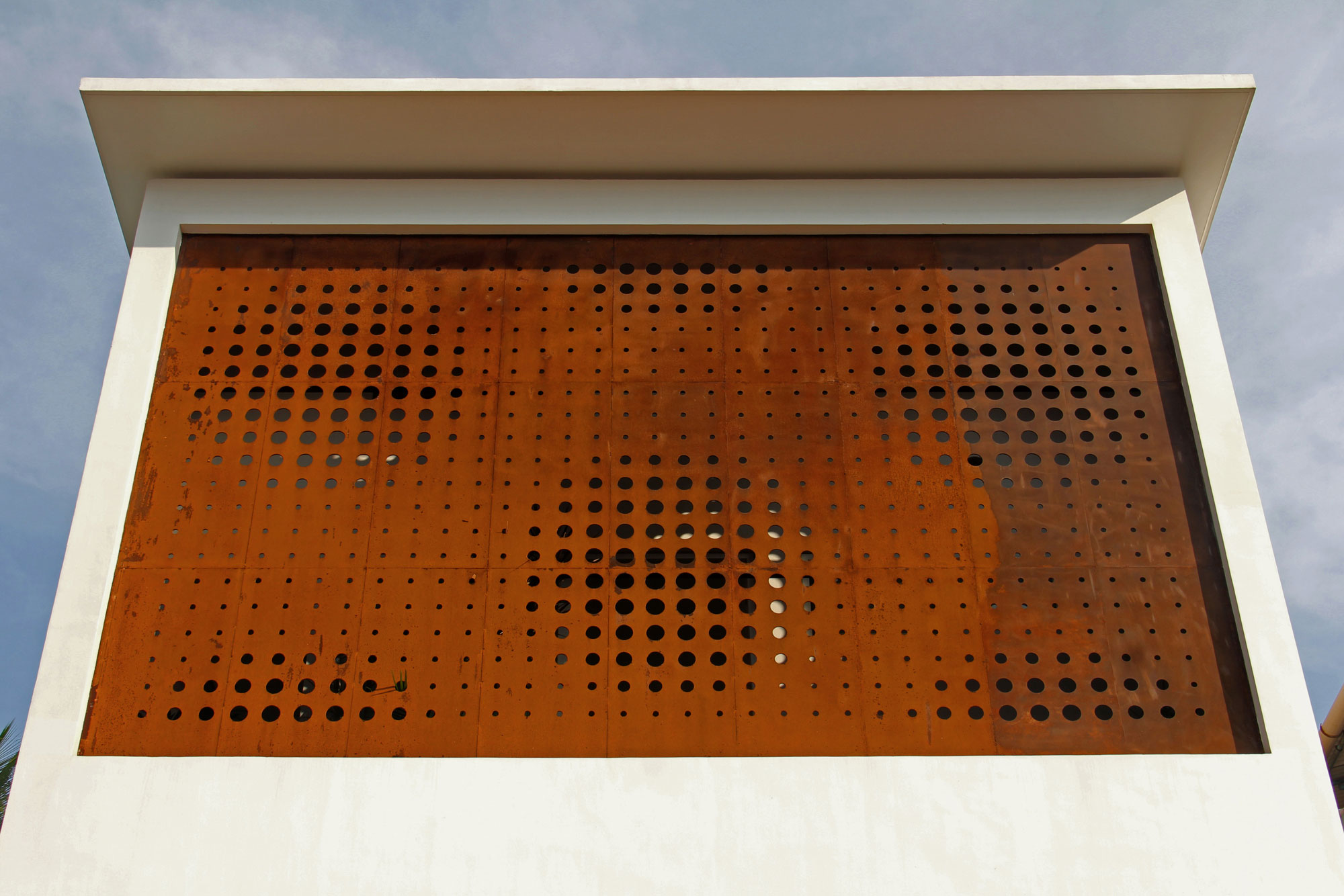A Stunning and Spacious Home Framed by Perforated Corten Steel Walls in Kerala, India by LIJO.RENY Architects (2)