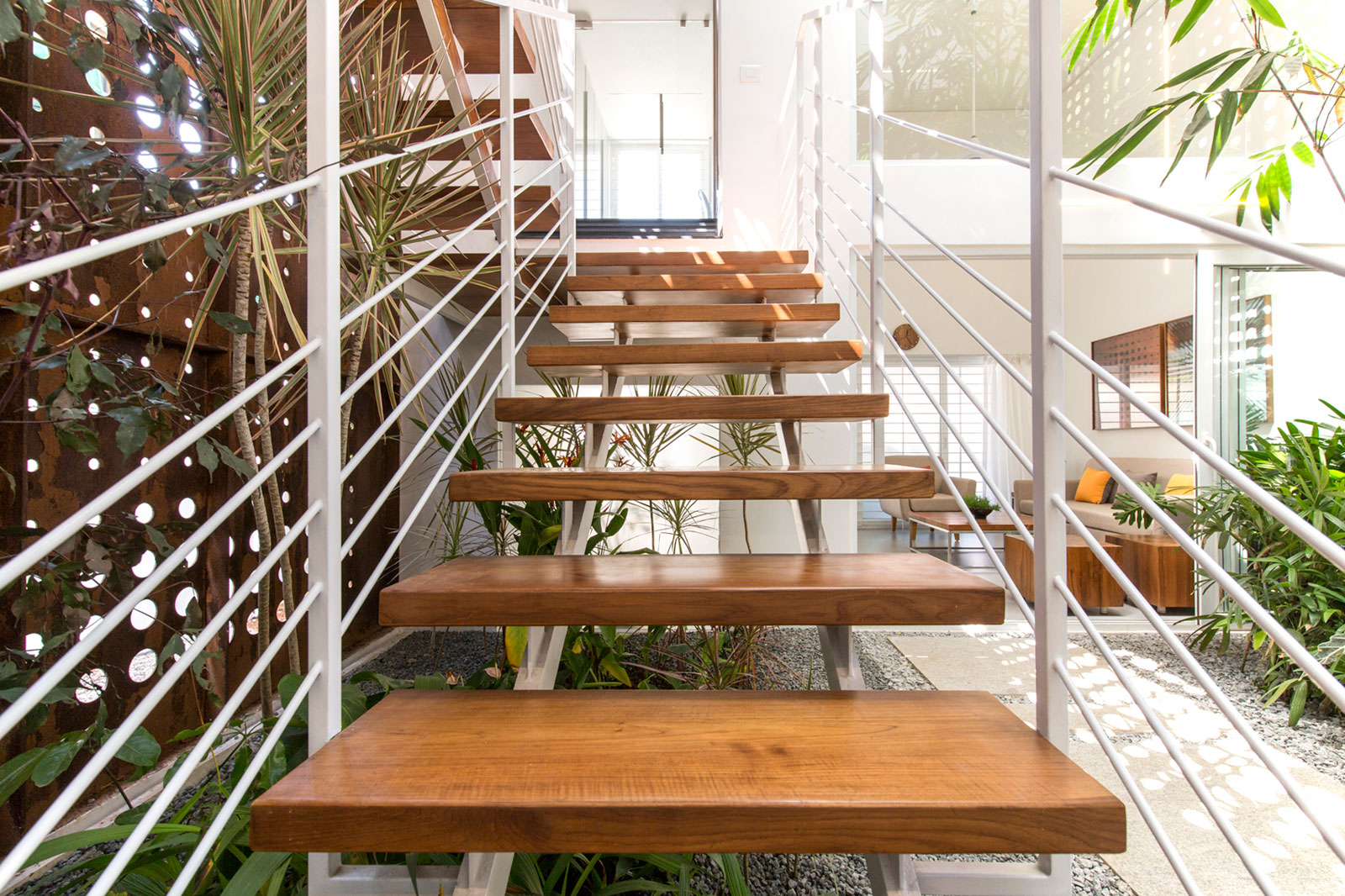 A Stunning and Spacious Home Framed by Perforated Corten Steel Walls in Kerala, India by LIJO.RENY Architects (20)