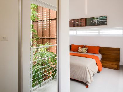 A Stunning and Spacious Home Framed by Perforated Corten Steel Walls in Kerala, India by LIJO.RENY Architects (23)