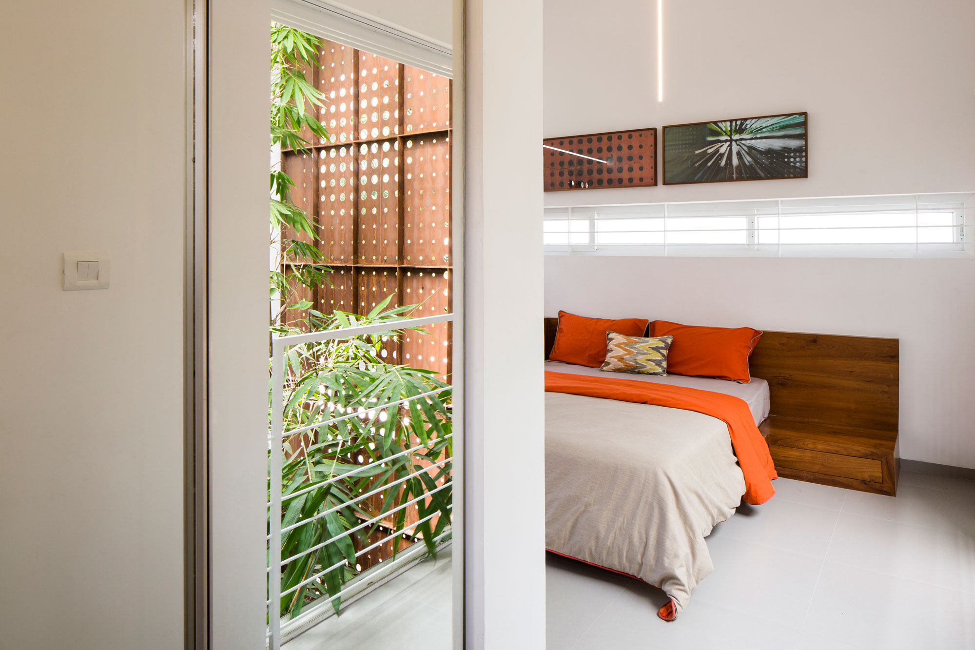 A Stunning and Spacious Home Framed by Perforated Corten Steel Walls in Kerala, India by LIJO.RENY Architects (23)