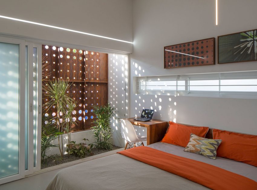 A Stunning and Spacious Home Framed by Perforated Corten Steel Walls in Kerala, India by LIJO.RENY Architects (24)