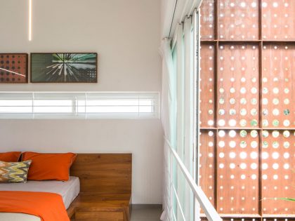 A Stunning and Spacious Home Framed by Perforated Corten Steel Walls in Kerala, India by LIJO.RENY Architects (26)