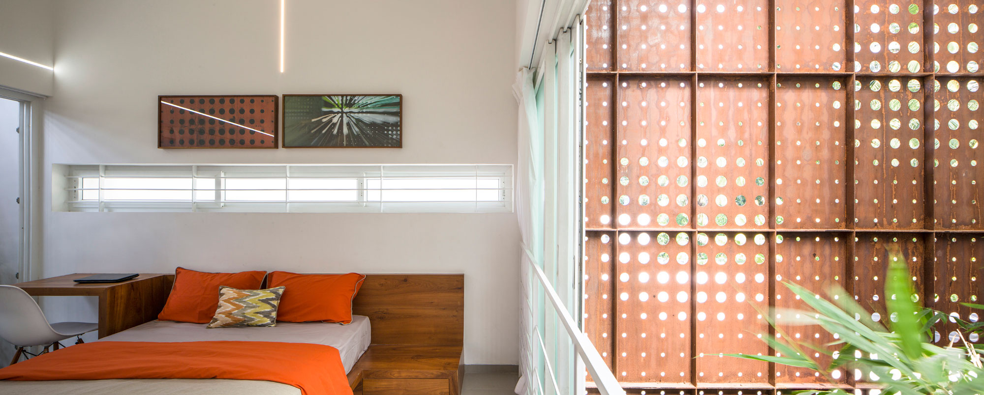 A Stunning and Spacious Home Framed by Perforated Corten Steel Walls in Kerala, India by LIJO.RENY Architects (26)