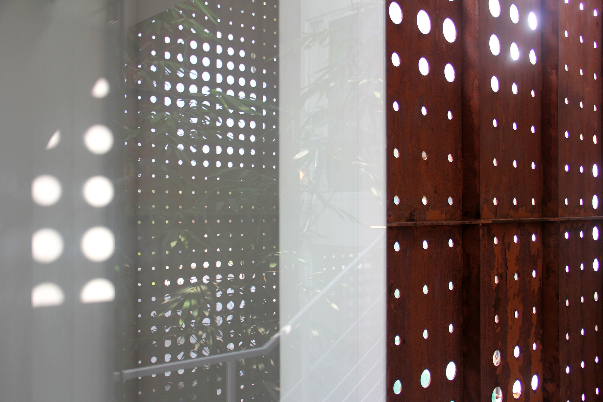 A Stunning and Spacious Home Framed by Perforated Corten Steel Walls in Kerala, India by LIJO.RENY Architects (27)