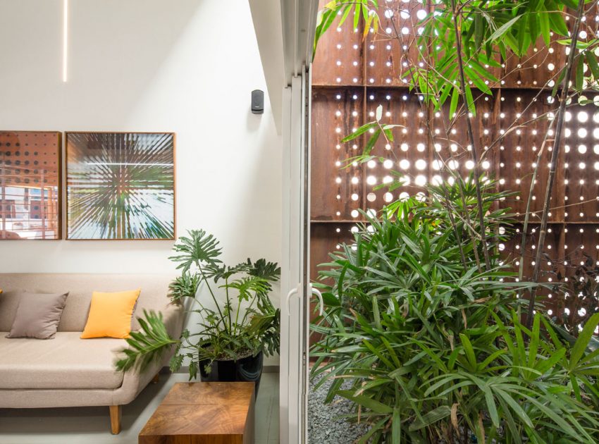 A Stunning and Spacious Home Framed by Perforated Corten Steel Walls in Kerala, India by LIJO.RENY Architects (8)