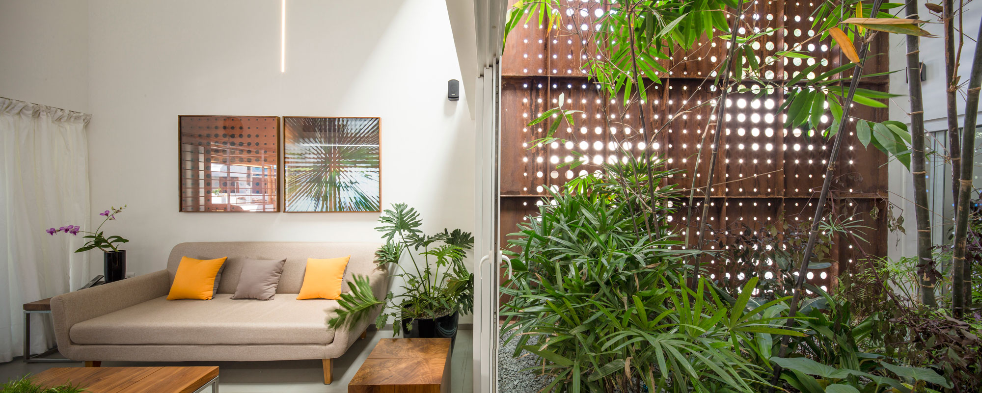 A Stunning and Spacious Home Framed by Perforated Corten Steel Walls in Kerala, India by LIJO.RENY Architects (8)