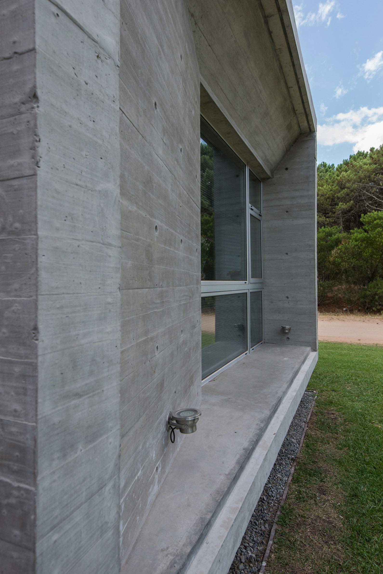 A Stylish Concrete Home Flanked by a Lush Pine Forest in Pinamar by Estudio Galera (12)