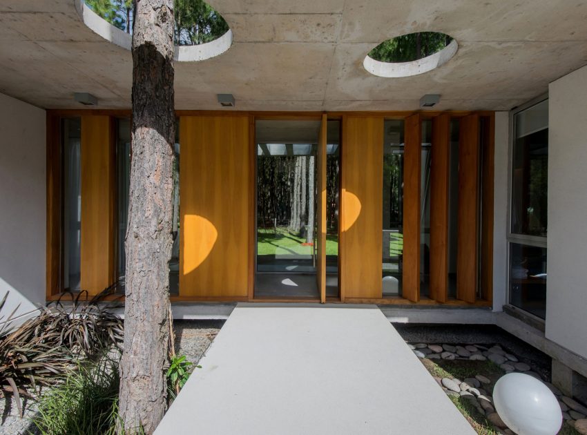 A Stylish Concrete Home Flanked by a Lush Pine Forest in Pinamar by Estudio Galera (13)