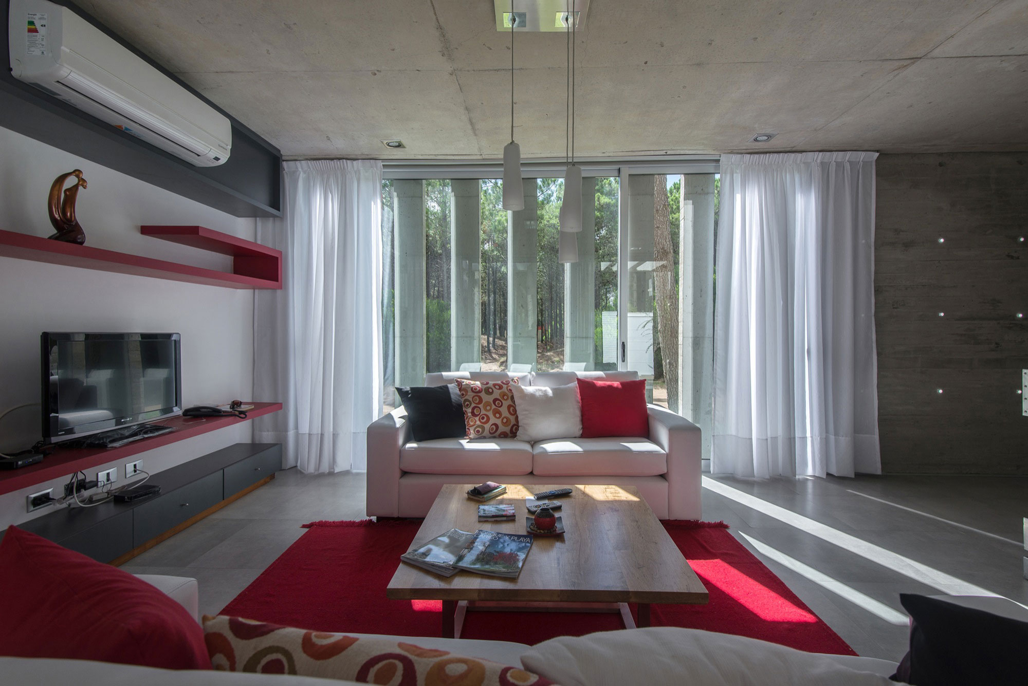 A Stylish Concrete Home Flanked by a Lush Pine Forest in Pinamar by Estudio Galera (14)