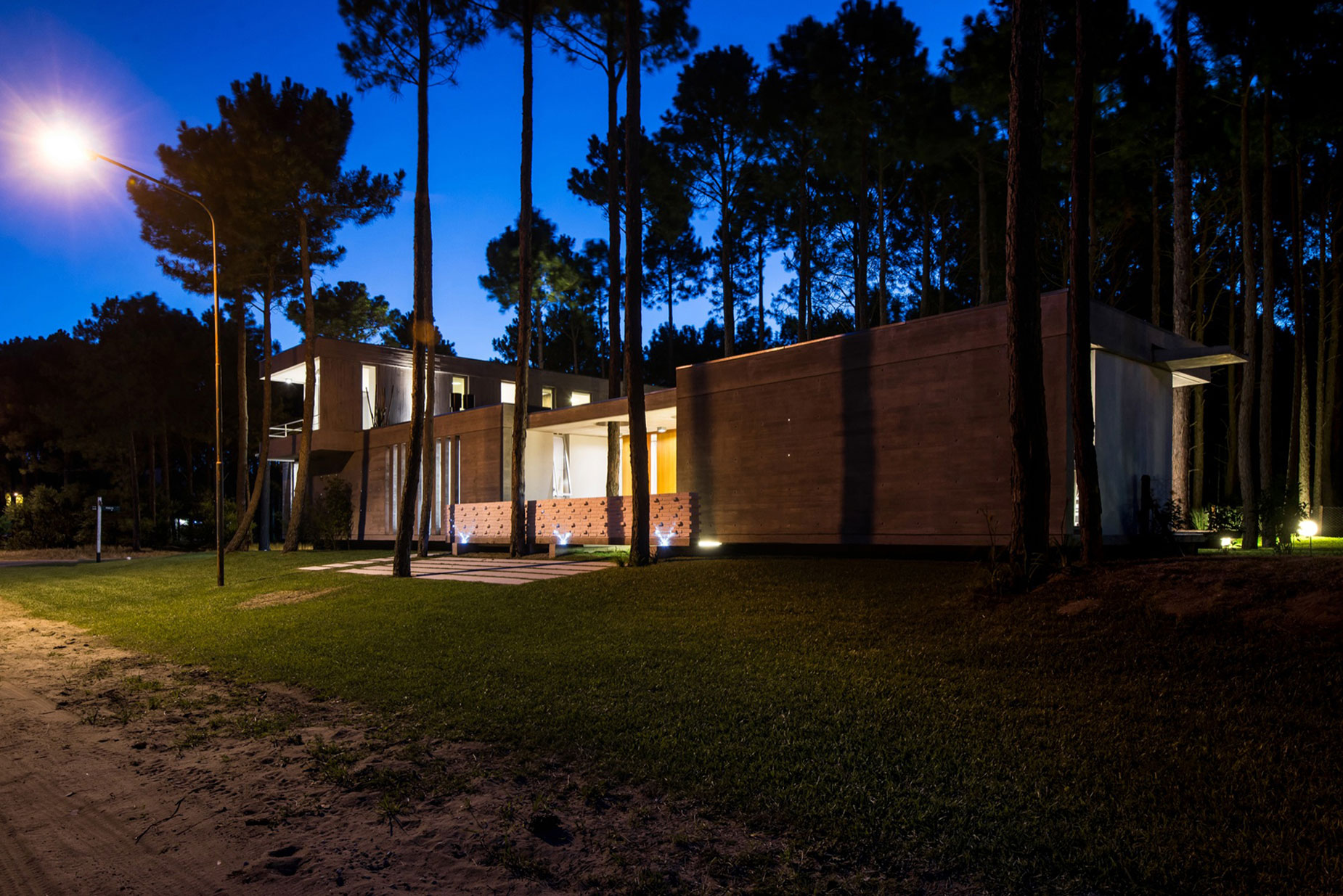 A Stylish Concrete Home Flanked by a Lush Pine Forest in Pinamar by Estudio Galera (25)