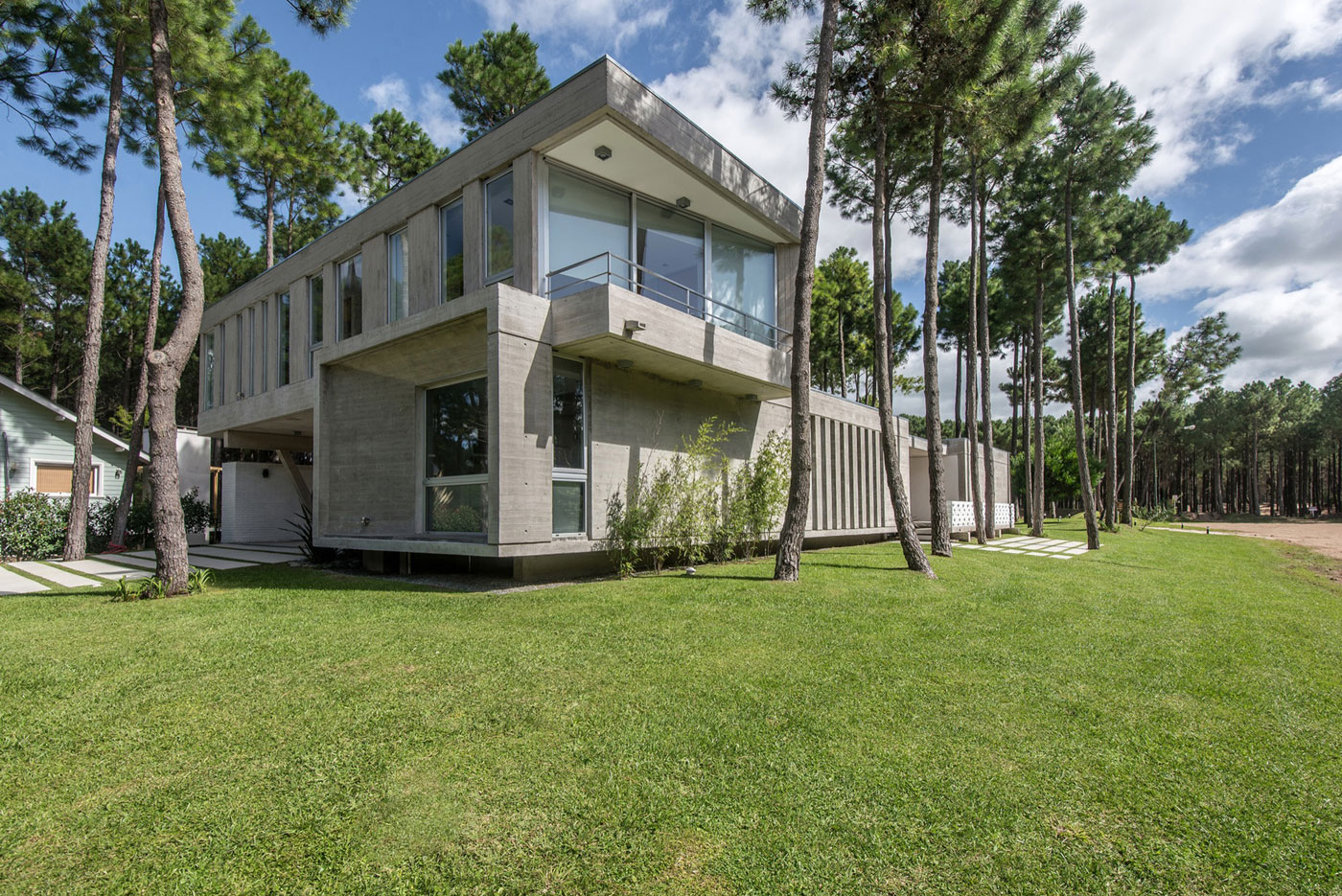 A Stylish Concrete Home Flanked by a Lush Pine Forest in Pinamar by Estudio Galera (3)