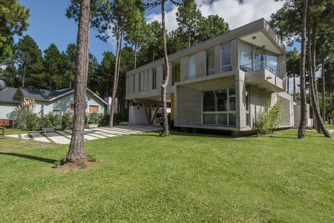 A Stylish Concrete Home Flanked by a Lush Pine Forest in Pinamar by Estudio Galera (4)
