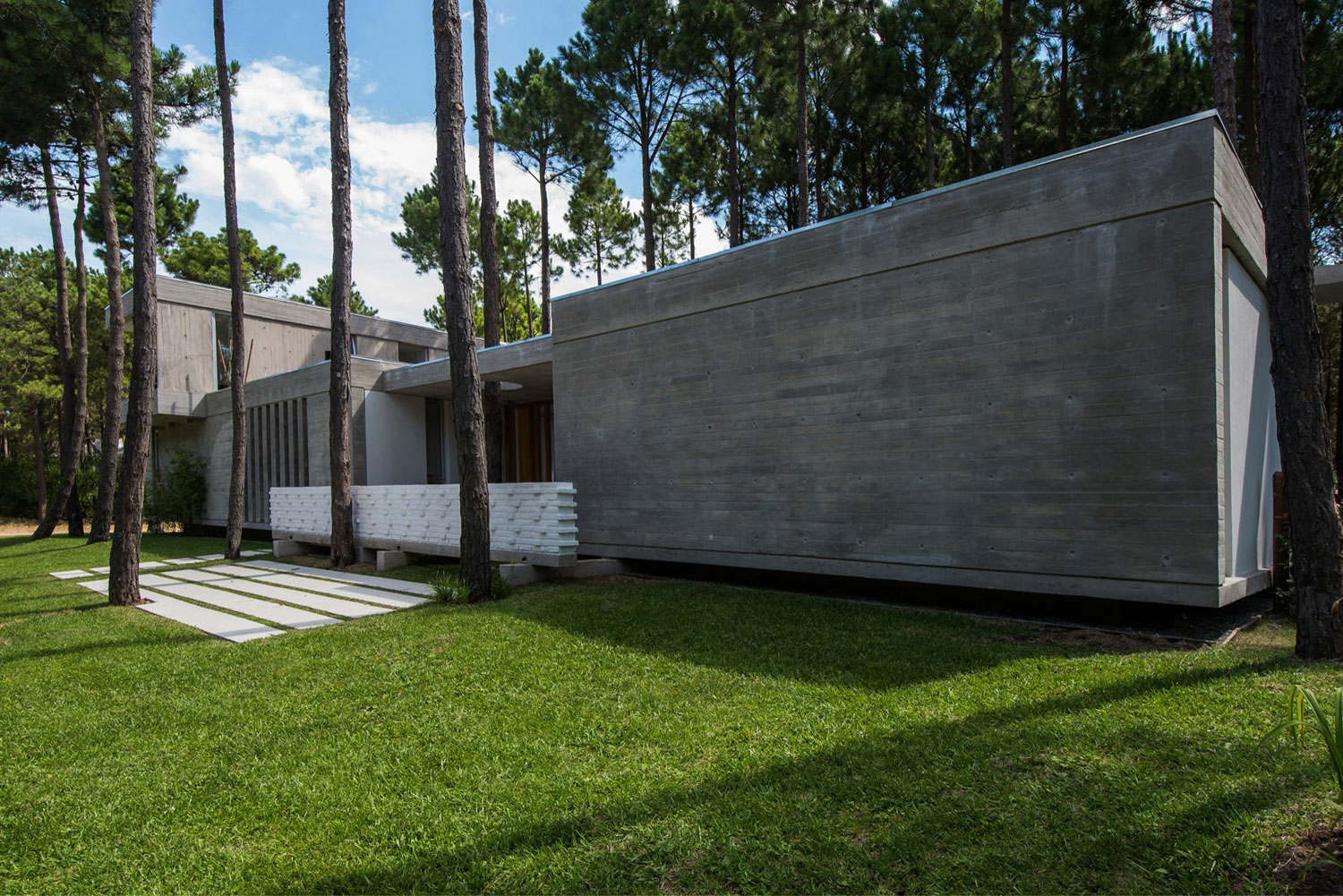 A Stylish Concrete Home Flanked by a Lush Pine Forest in Pinamar by Estudio Galera (6)