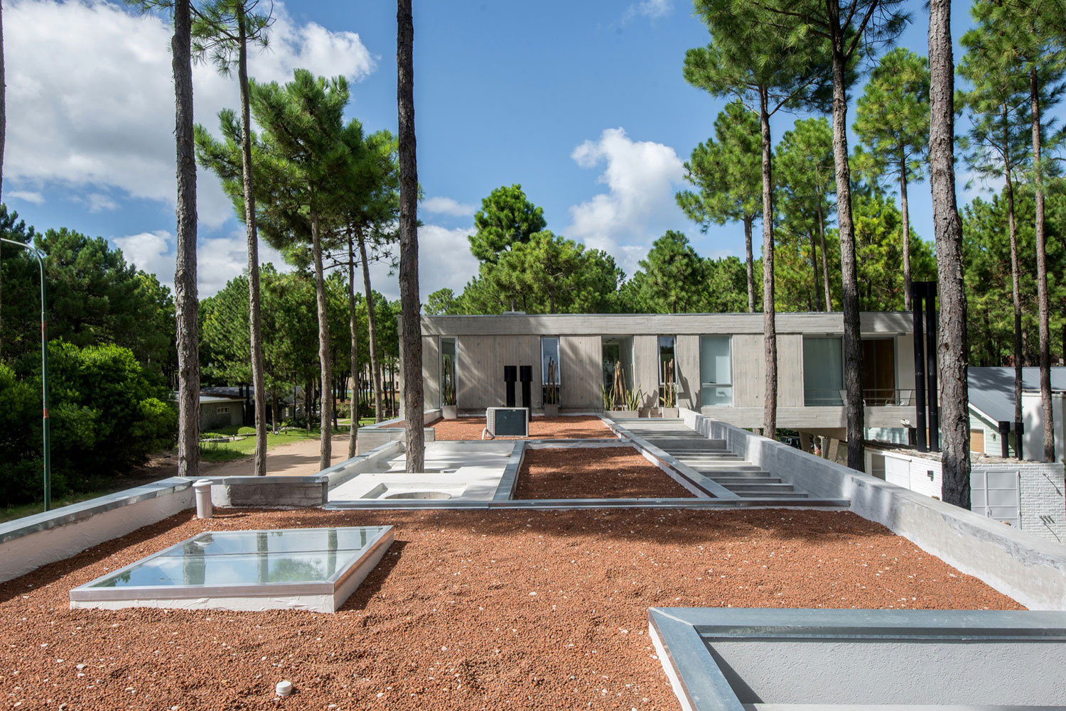 A Stylish Concrete Home Flanked by a Lush Pine Forest in Pinamar by Estudio Galera (9)