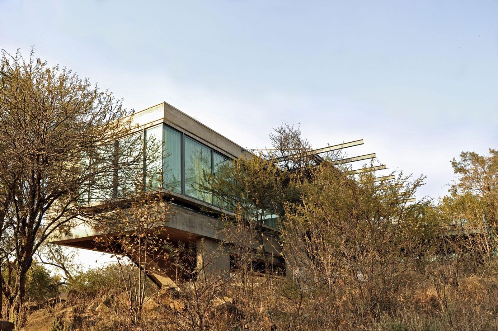 A Stylish Cantilevered Concrete Home with Stunning Character in Pretoria, South Africa by Earthworld Architects & Interiors (2)