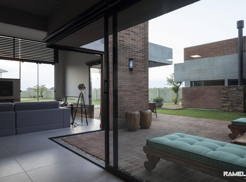 A Stylish Contemporary Home Made of Concrete and Red Bricks in Rio Grande do Sul by Ramella Arquitetura (10)