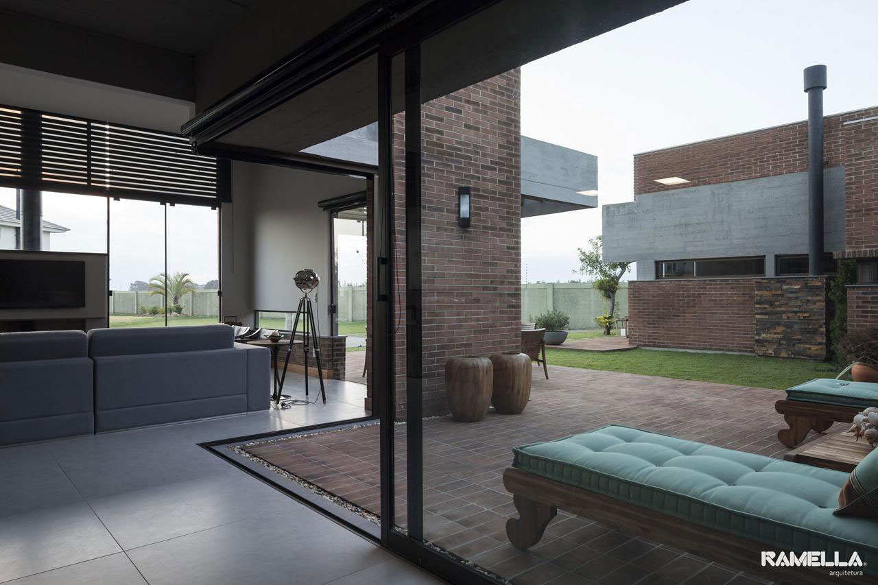 A Stylish Contemporary Home Made of Concrete and Red Bricks in Rio Grande do Sul by Ramella Arquitetura (10)