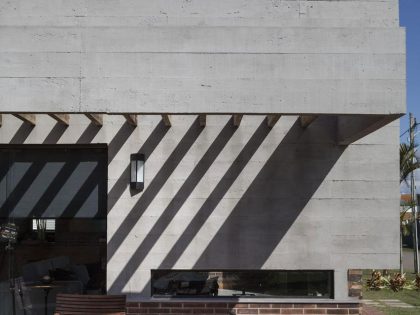 A Stylish Contemporary Home Made of Concrete and Red Bricks in Rio Grande do Sul by Ramella Arquitetura (5)