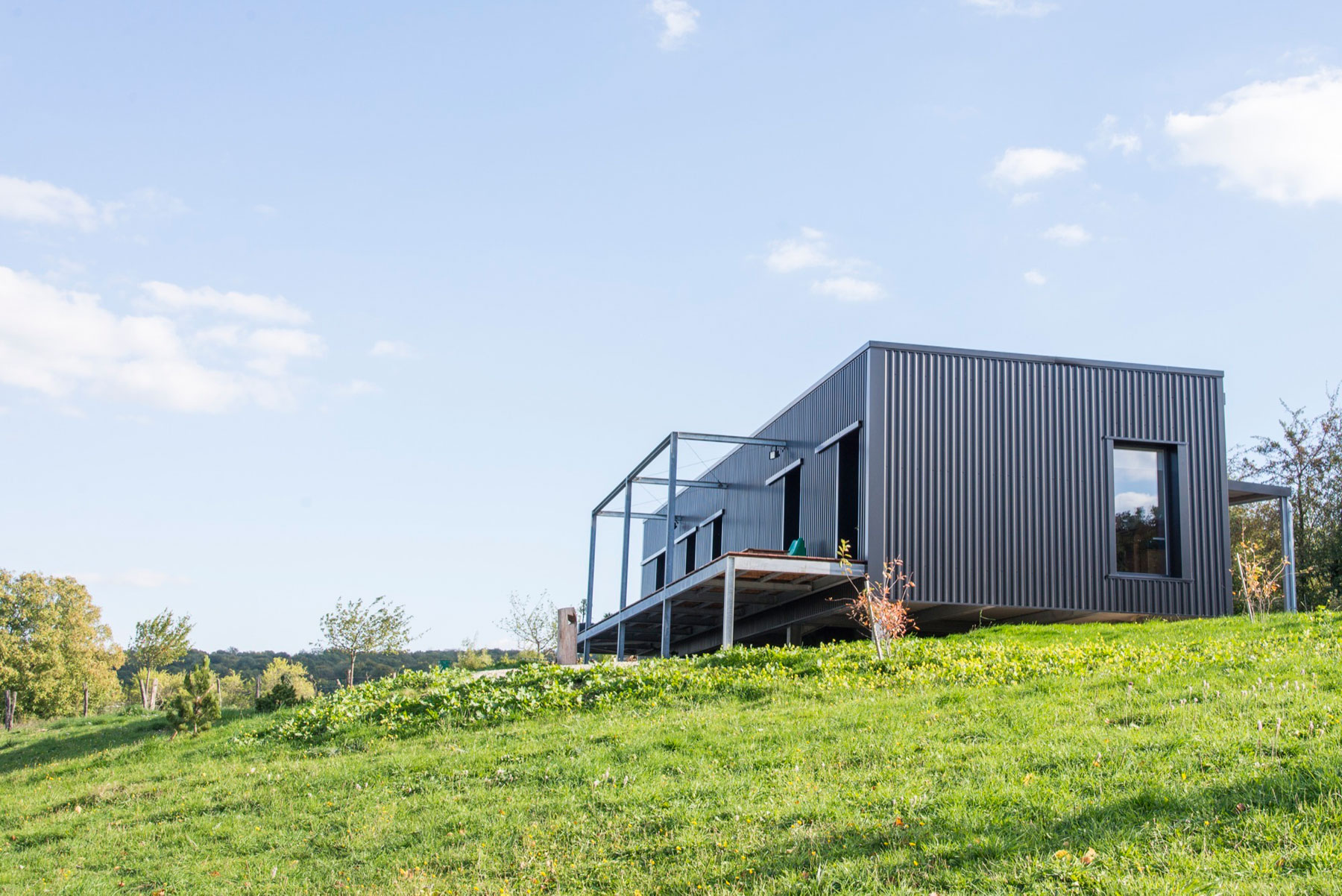 A Two Shipping Containers Turned into a Modern House for a Writer and Sculptor in Saint-Bresson by Spray Architecture & Gabrielle Vella-Boucaud (3)