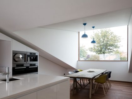 A Unique Modern Home with Sloping Green Roof and Split-Level Interior in Maldegem, Belgium by OYO (11)