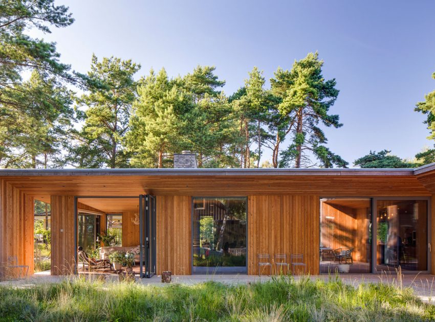 An Elegant Contemporary Villa Surrounded by Tall Pine Trees in Höllviken, Sweden by Johan Sundberg (4)