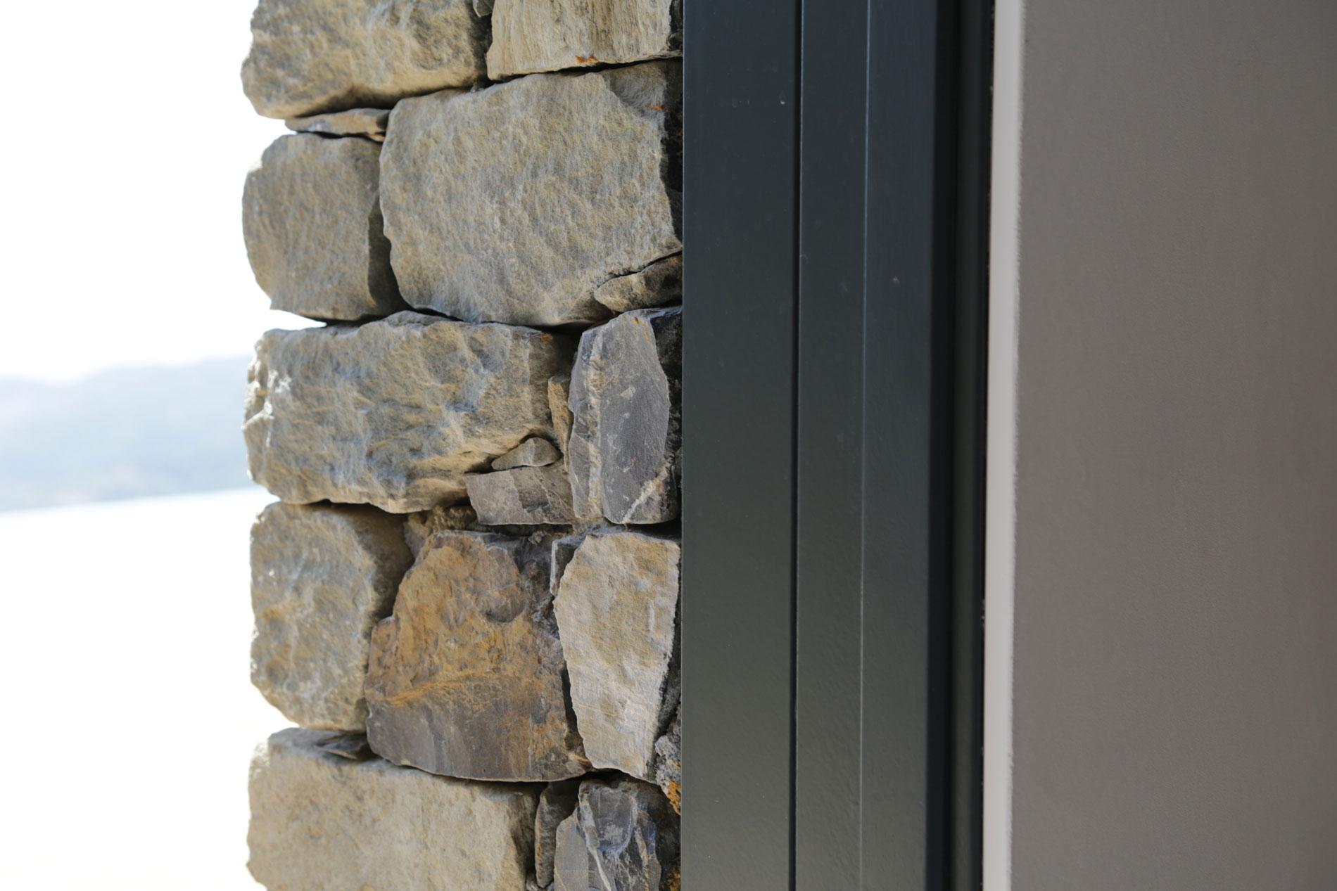 An Elegant Mediterranean Villa with Natural Stone Façade in Imperia, Italy by Giordano Hadamik Architects (16)