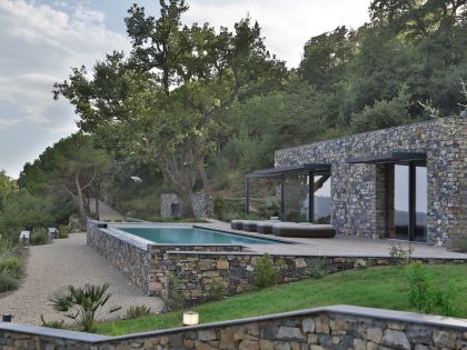 An Elegant Mediterranean Villa with Natural Stone Façade in Imperia, Italy by Giordano Hadamik Architects (3)