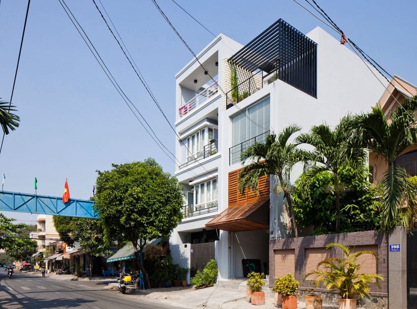 An Elegant and Light-Filled Modern Townhouse with a Folding-Up Shutter in Ho Chi Minh by MM++ architects (1)