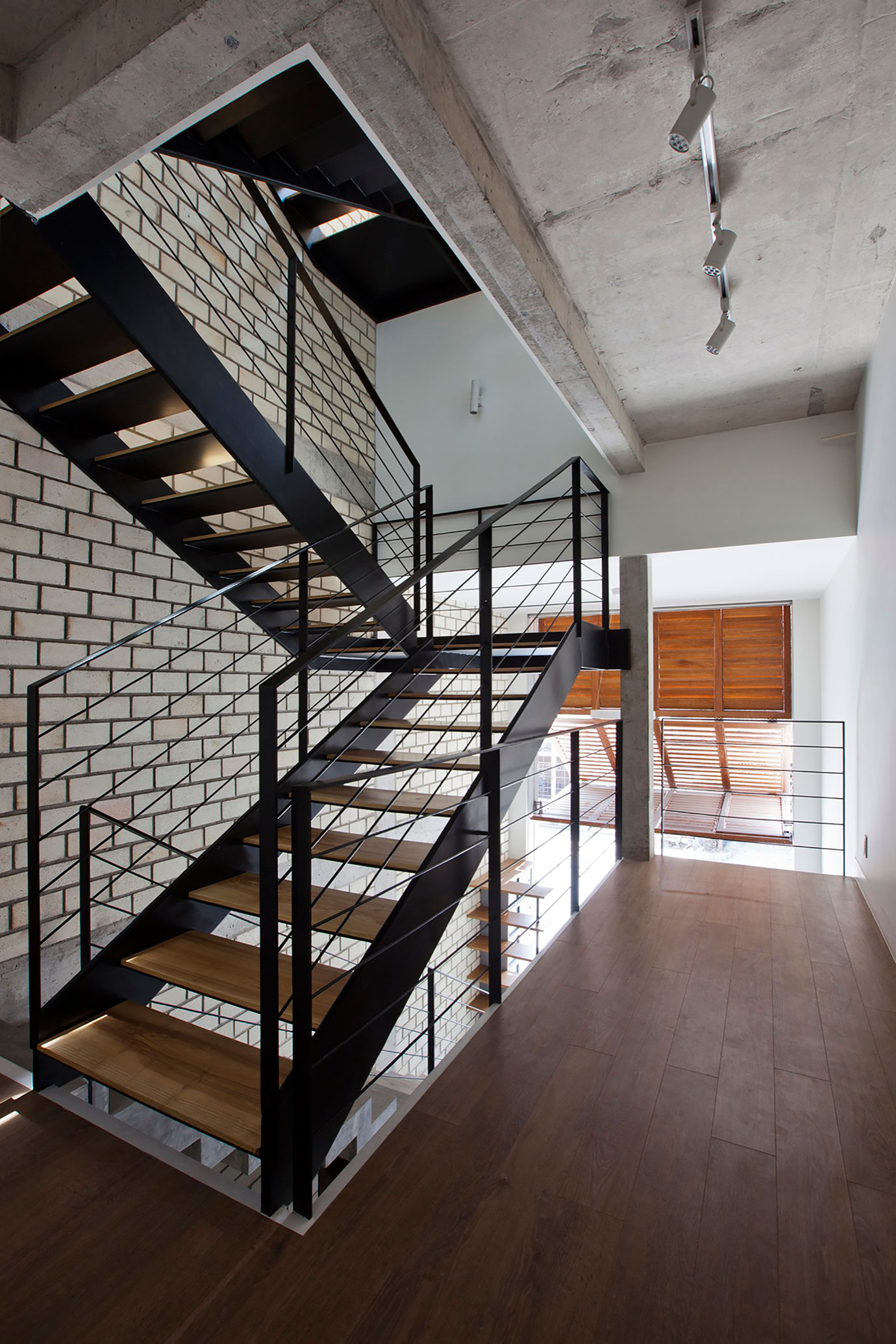 An Elegant and Light-Filled Modern Townhouse with a Folding-Up Shutter in Ho Chi Minh by MM++ architects (11)