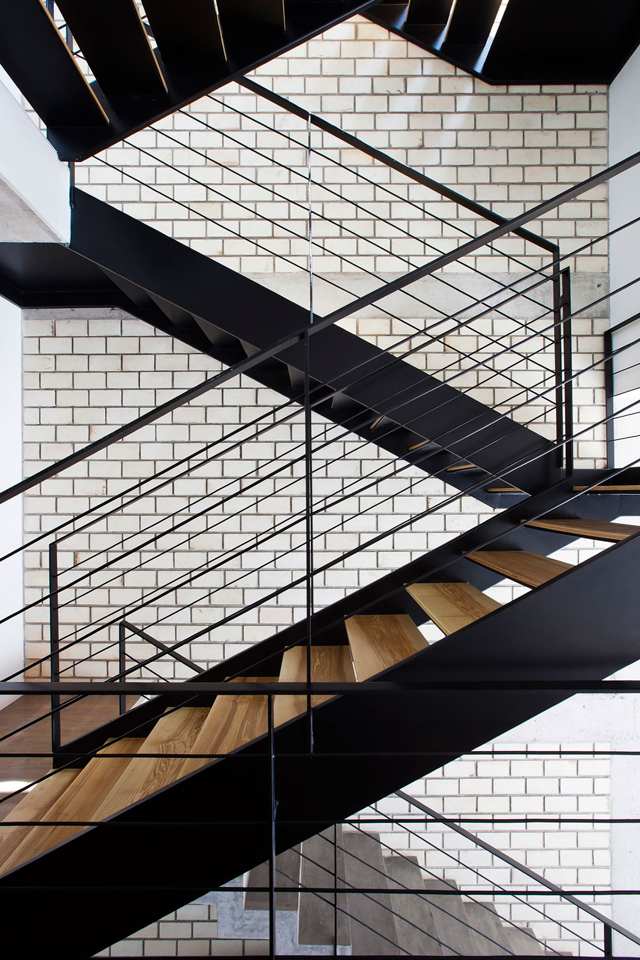 An Elegant and Light-Filled Modern Townhouse with a Folding-Up Shutter in Ho Chi Minh by MM++ architects (12)