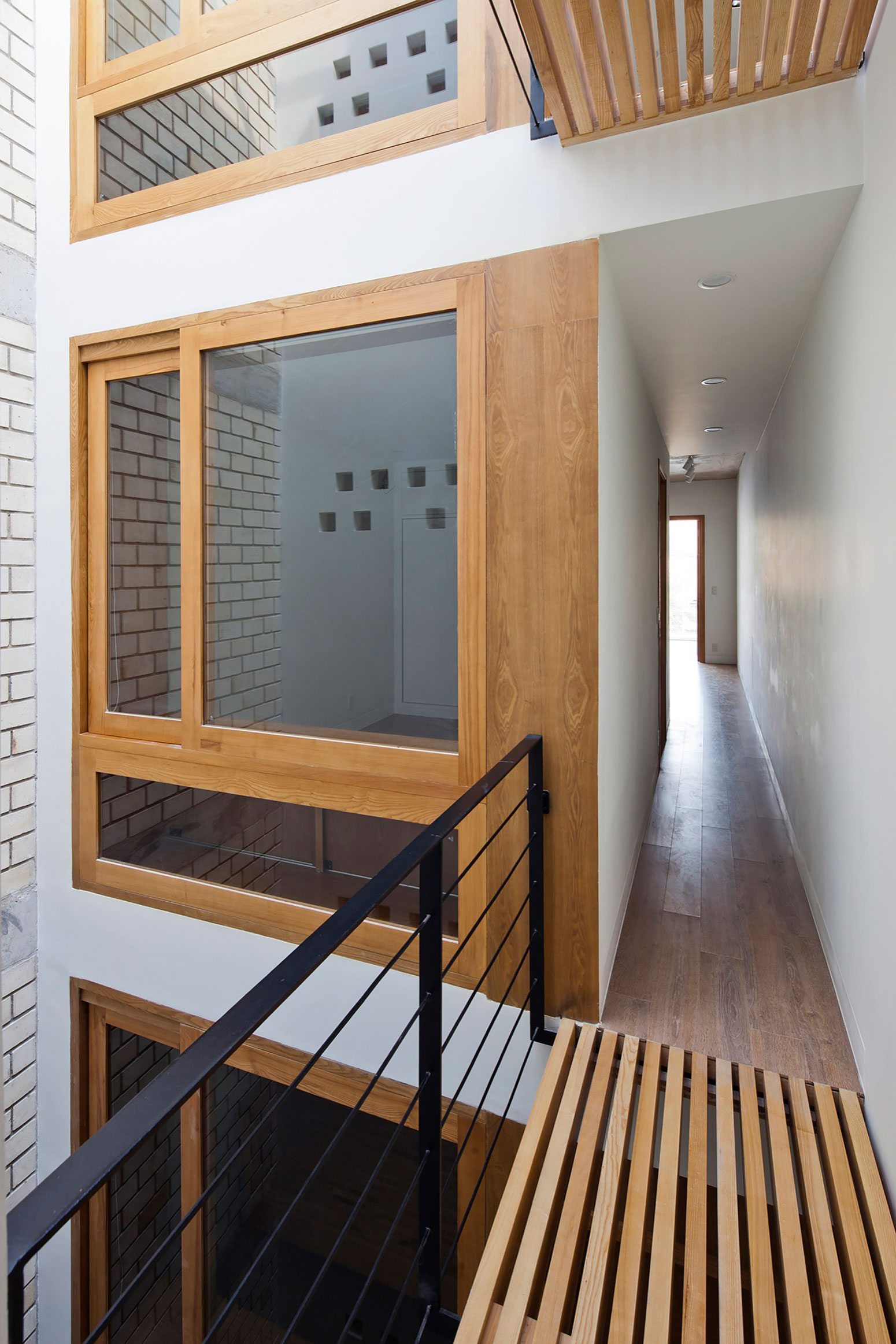 An Elegant and Light-Filled Modern Townhouse with a Folding-Up Shutter in Ho Chi Minh by MM++ architects (15)