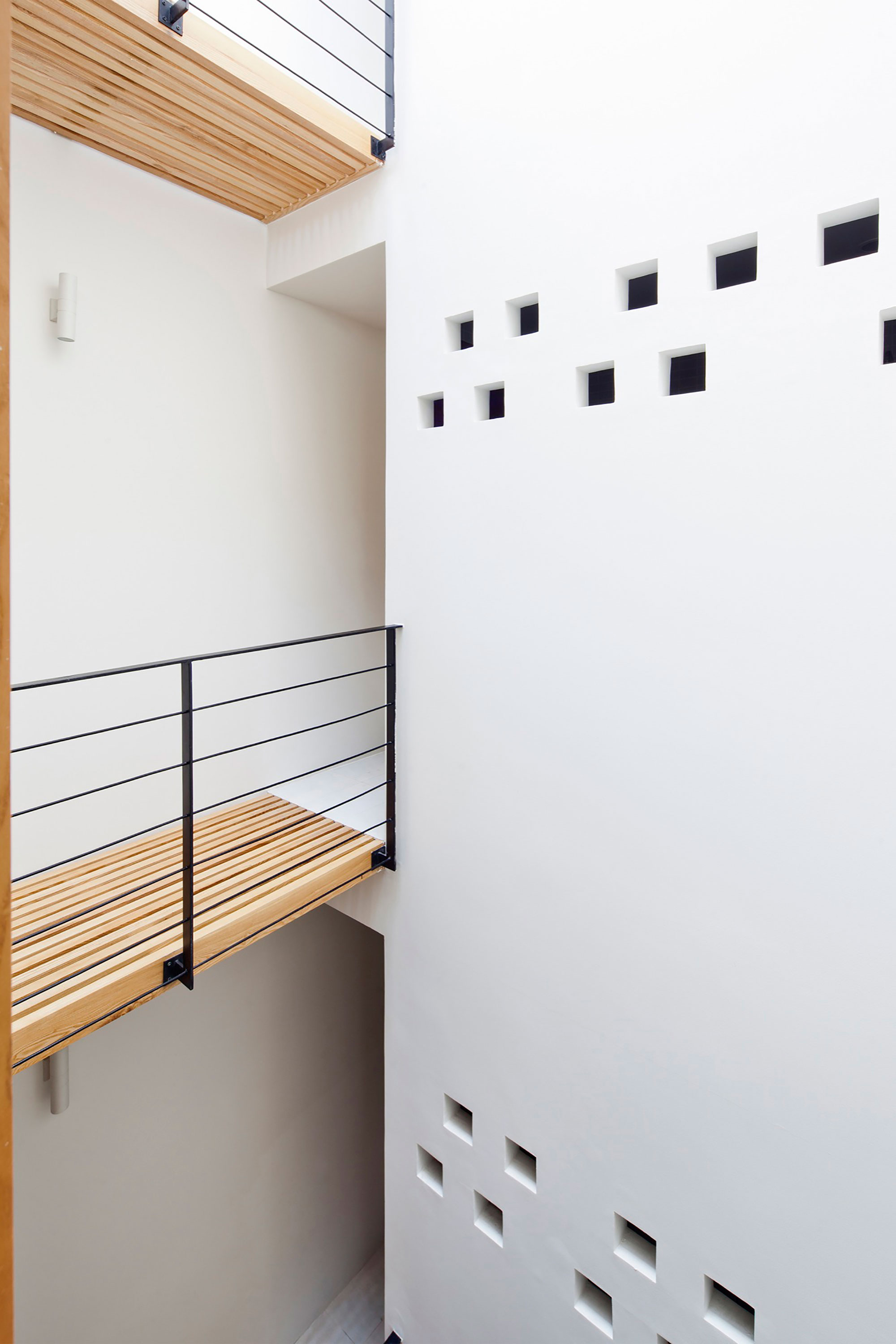 An Elegant and Light-Filled Modern Townhouse with a Folding-Up Shutter in Ho Chi Minh by MM++ architects (16)