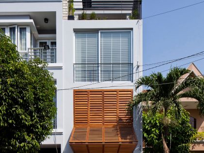 An Elegant and Light-Filled Modern Townhouse with a Folding-Up Shutter in Ho Chi Minh by MM++ architects (2)