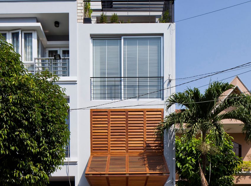 An Elegant and Light-Filled Modern Townhouse with a Folding-Up Shutter in Ho Chi Minh by MM++ architects (2)