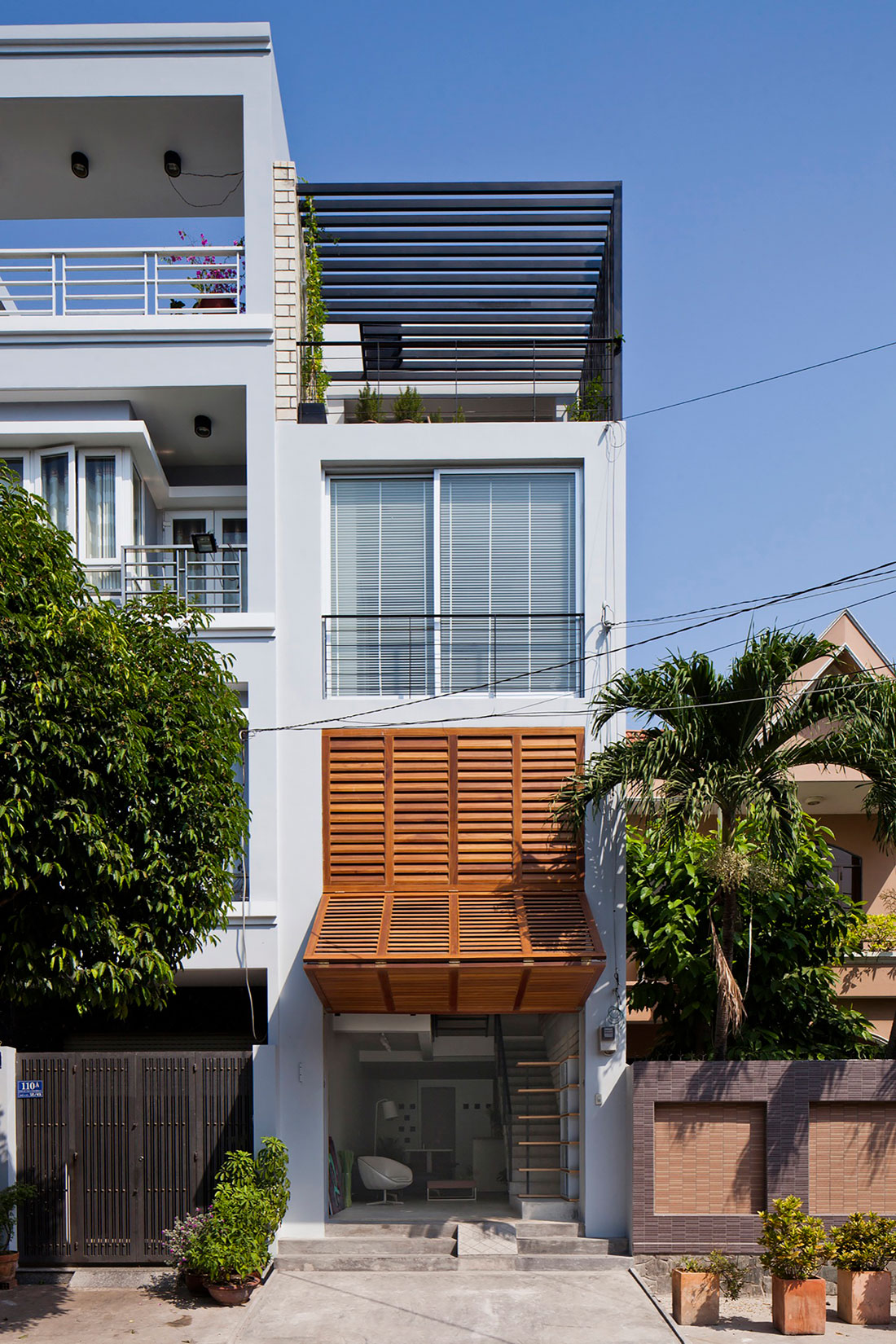 An Elegant and Light-Filled Modern Townhouse with a Folding-Up Shutter in Ho Chi Minh by MM++ architects (2)