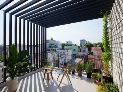 An Elegant and Light-Filled Modern Townhouse with a Folding-Up Shutter in Ho Chi Minh by MM++ architects (5)