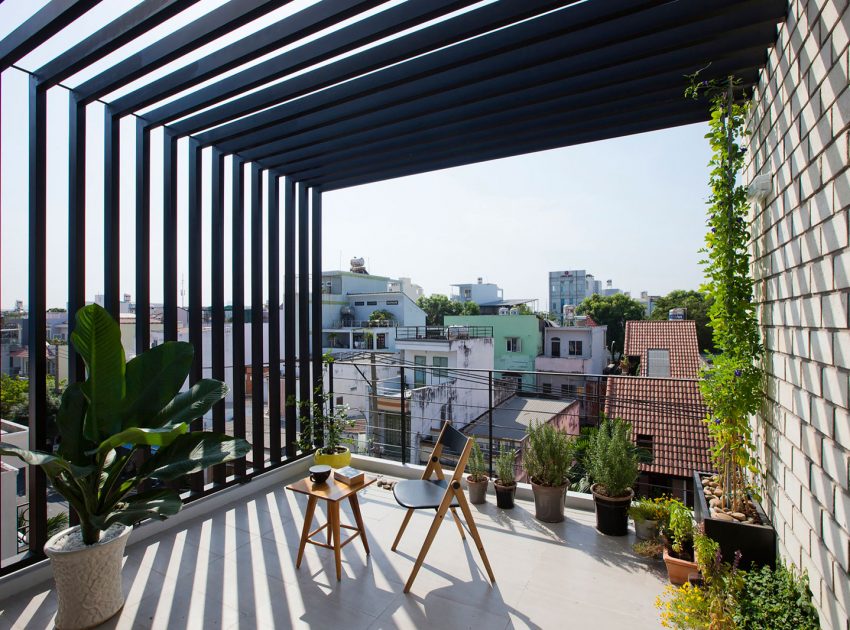 An Elegant and Light-Filled Modern Townhouse with a Folding-Up Shutter in Ho Chi Minh by MM++ architects (5)