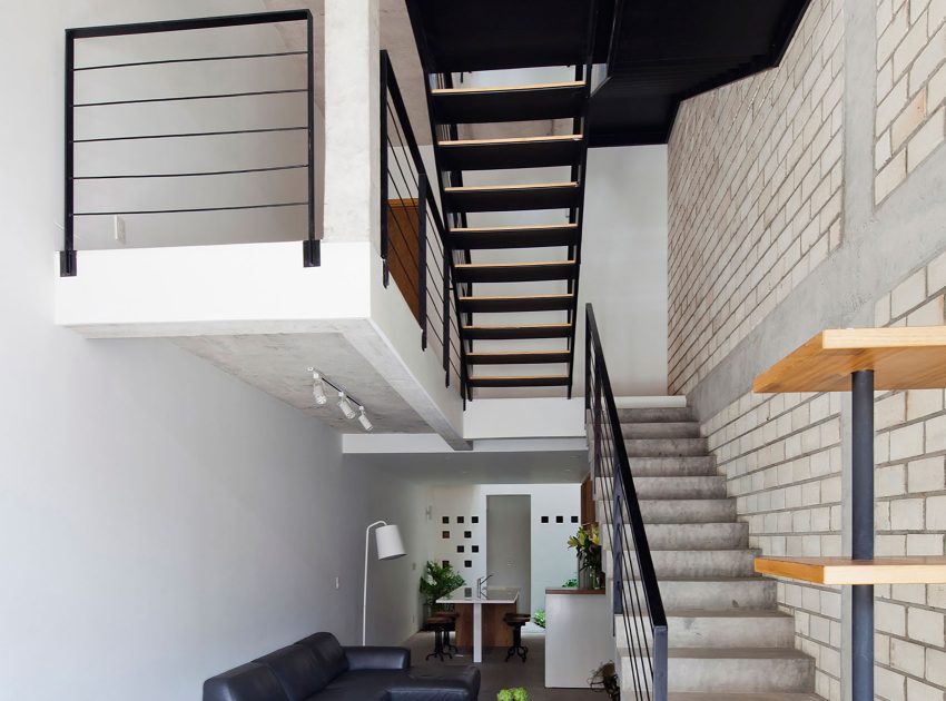 An Elegant and Light-Filled Modern Townhouse with a Folding-Up Shutter in Ho Chi Minh by MM++ architects (7)