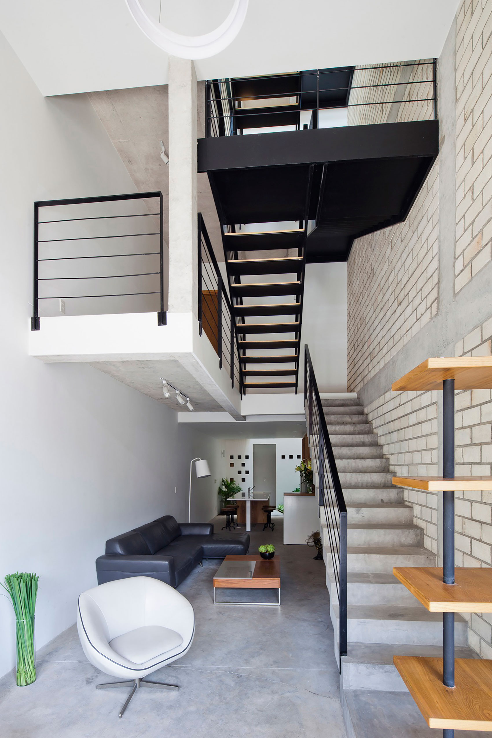 An Elegant and Light-Filled Modern Townhouse with a Folding-Up Shutter in Ho Chi Minh by MM++ architects (7)