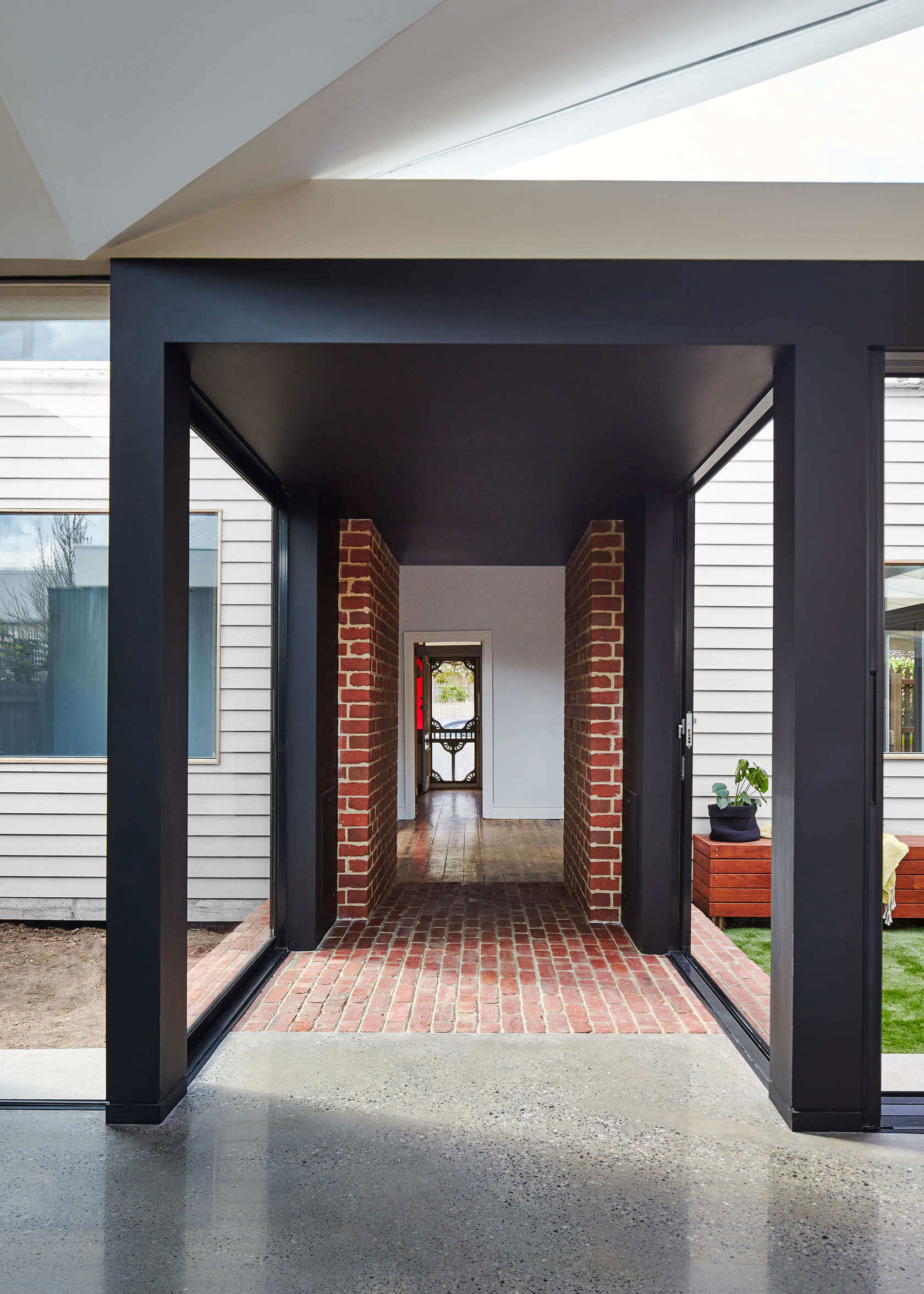 A Contemporary House Framed by Reclaimed Bricks and Separated Glass in Hawthorn by MODO (5)