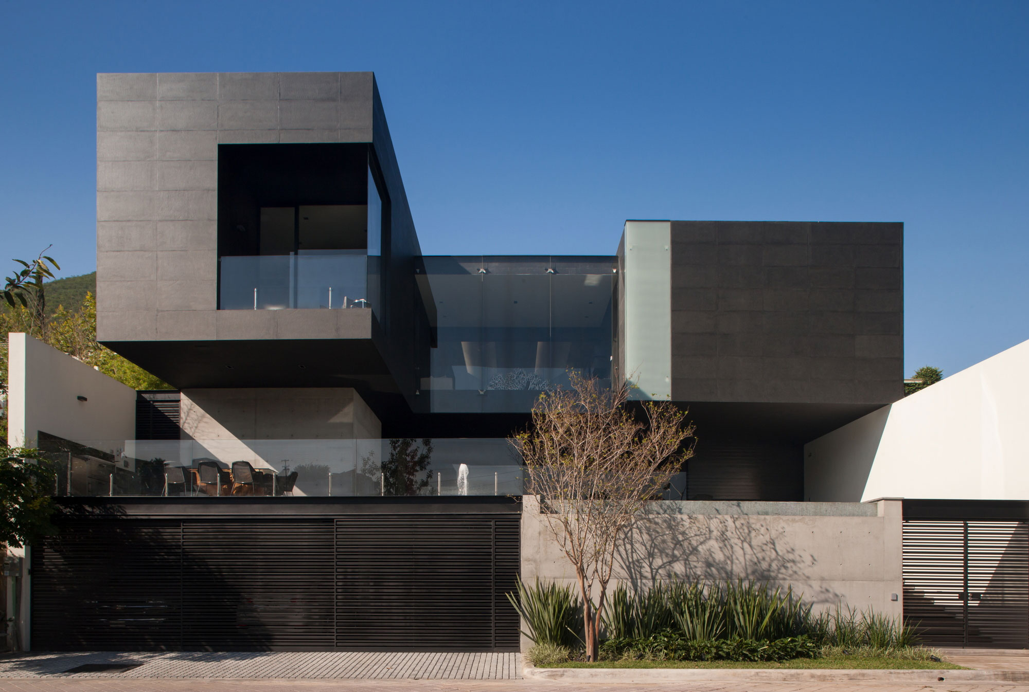 A Beautiful Modern Home with Cantilevered Volume and Floor-to-Ceiling Glass Walls in Garza Garcia by GLR Arquitectos (1)