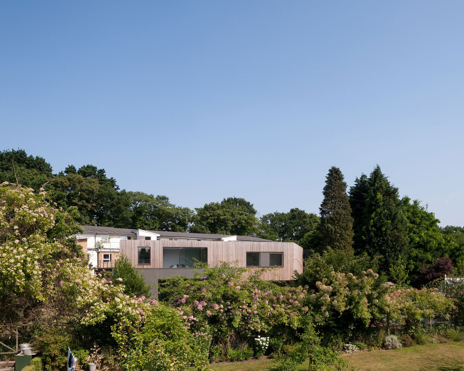 A Beautiful Multi-Faceted Modern Home for a Family of Three Generations in Surrey, England by SOUP Architects (7)