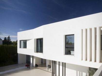 A Bright Contemporary Home with Pool and White Interior and Exterior in Albolote, Spain