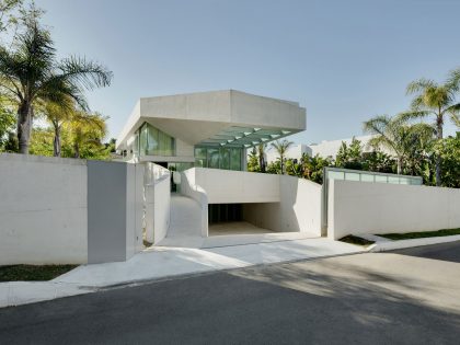 A Bright Modern Concrete Home with Cantilevered Rooftop Pool in Marbella, Spain
