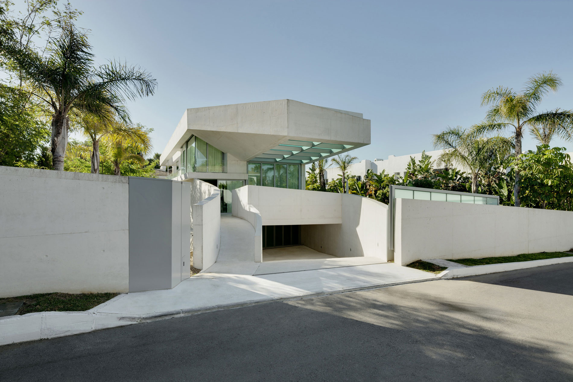 A Bright Modern Concrete Home with Cantilevered Rooftop Pool in Marbella, Spain by Wiel Arets Architects (1)