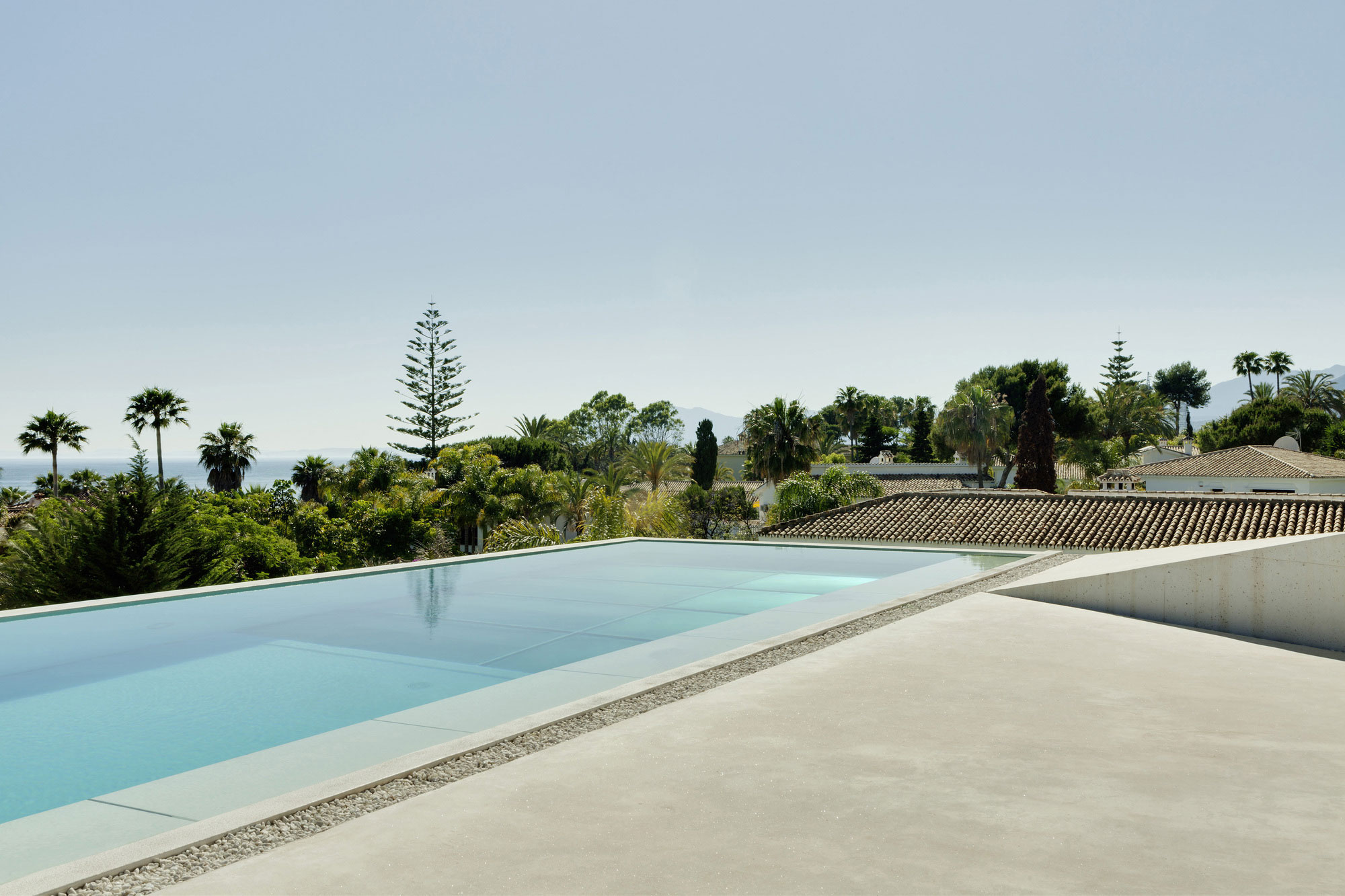 A Bright Modern Concrete Home with Cantilevered Rooftop Pool in Marbella, Spain by Wiel Arets Architects (10)