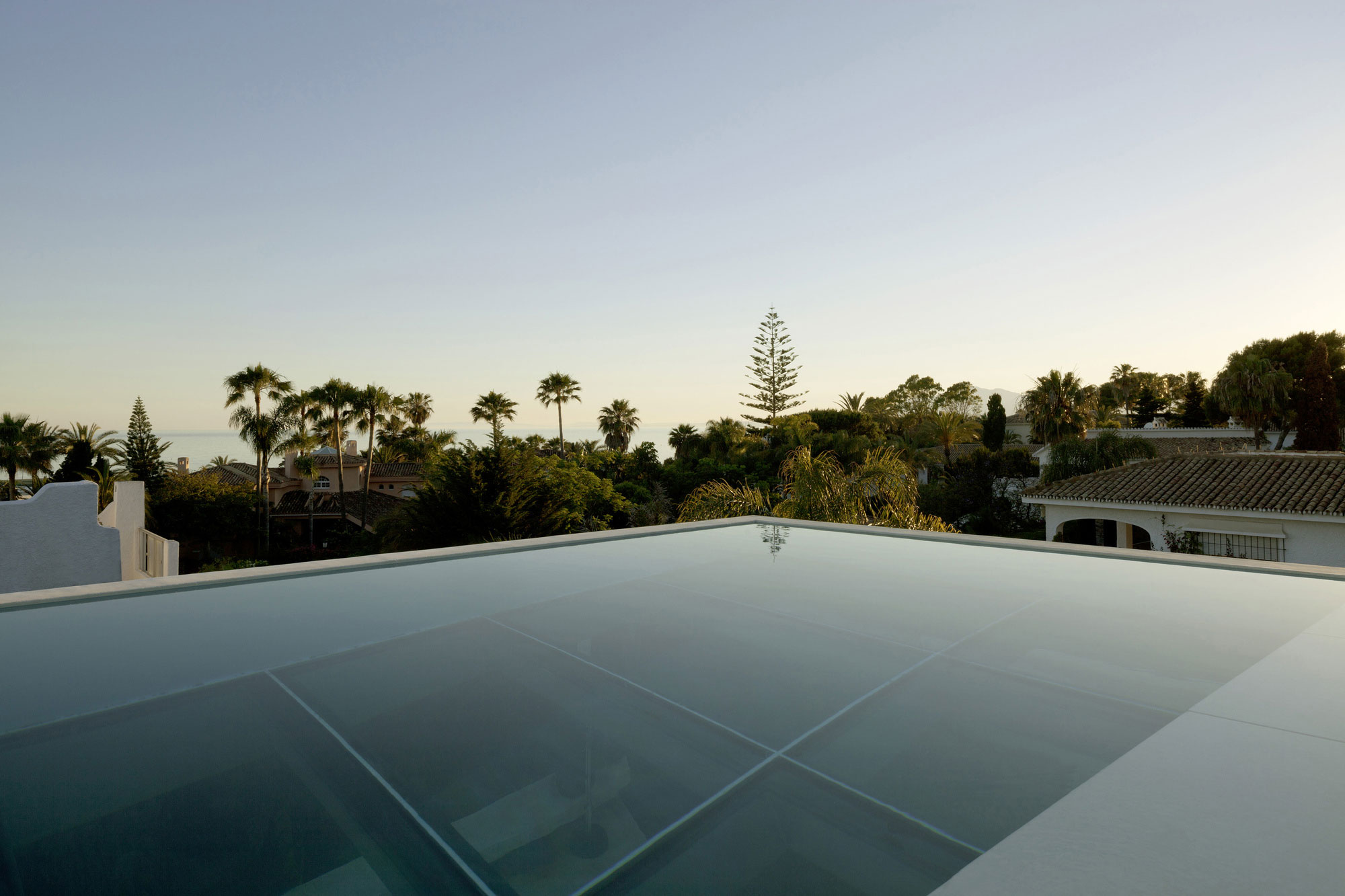 A Bright Modern Concrete Home with Cantilevered Rooftop Pool in Marbella, Spain by Wiel Arets Architects (11)