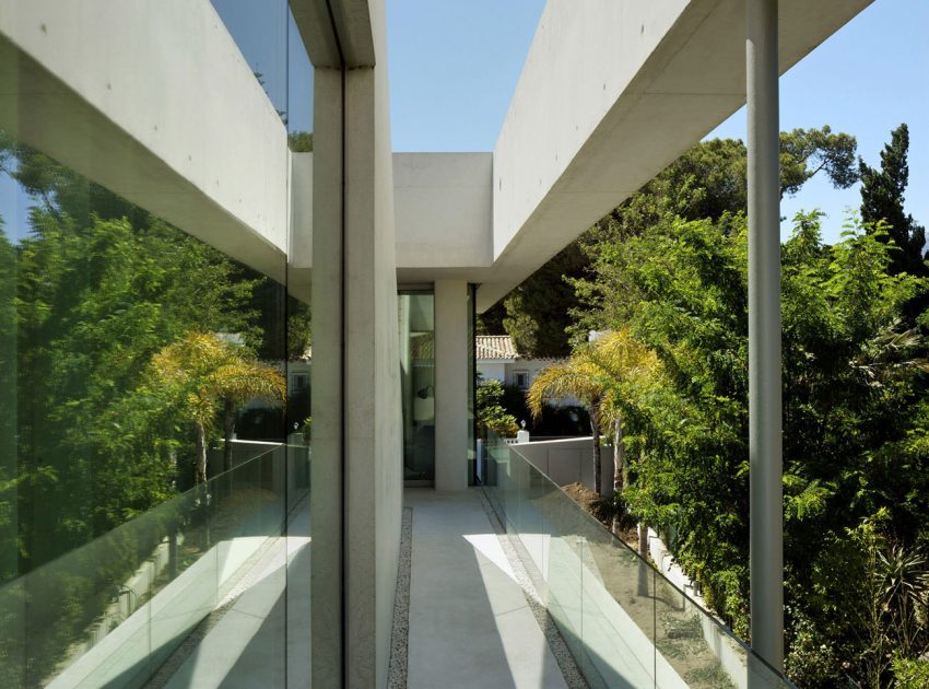 A Bright Modern Concrete Home with Cantilevered Rooftop Pool in Marbella, Spain by Wiel Arets Architects (12)
