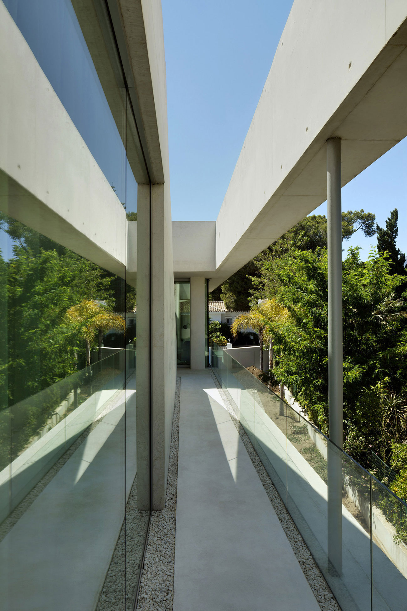 A Bright Modern Concrete Home with Cantilevered Rooftop Pool in Marbella, Spain by Wiel Arets Architects (12)