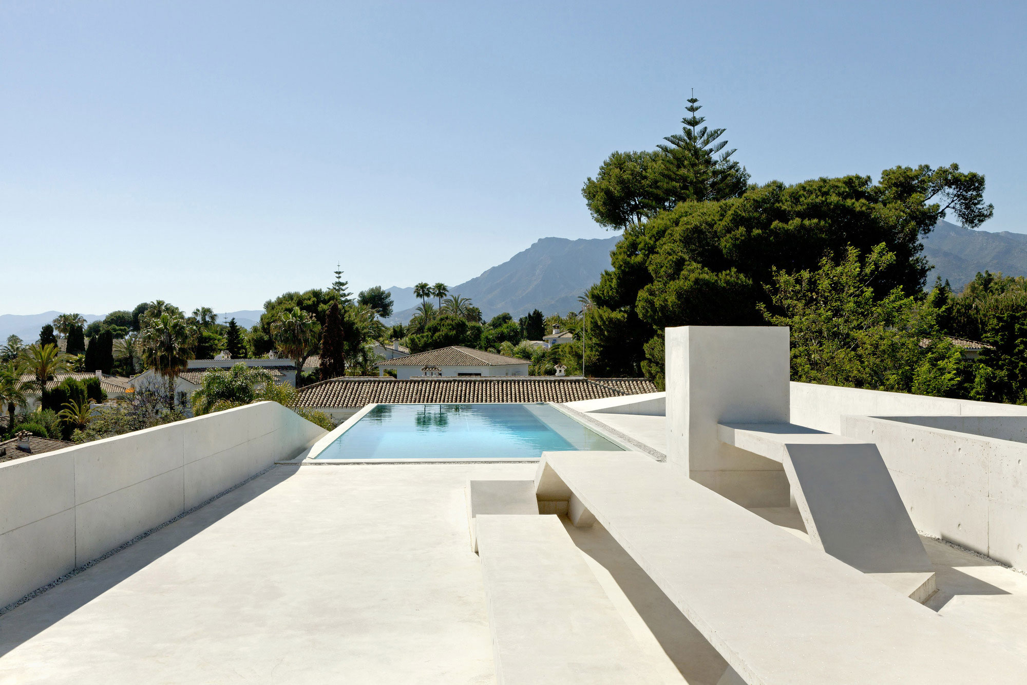 A Bright Modern Concrete Home with Cantilevered Rooftop Pool in Marbella, Spain by Wiel Arets Architects (9)